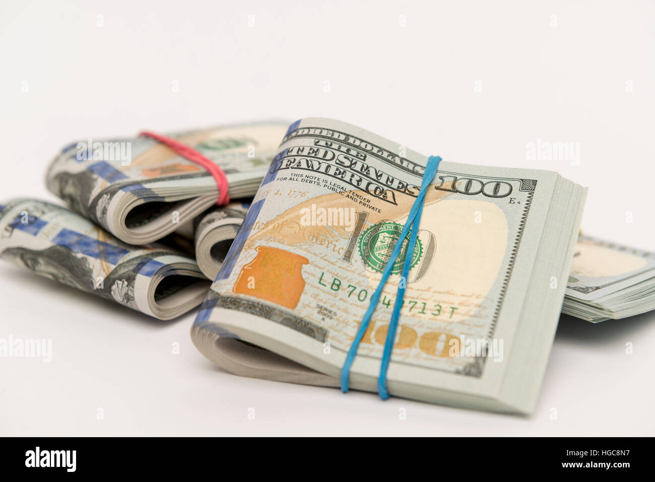 Packs of hundred dollar banknotes with rubber bands Stock Photo Alamy