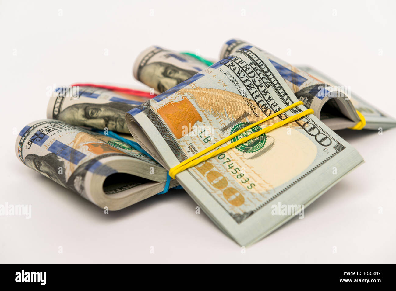 Packs of hundred dollar banknotes with rubber bands Stock Photo Alamy