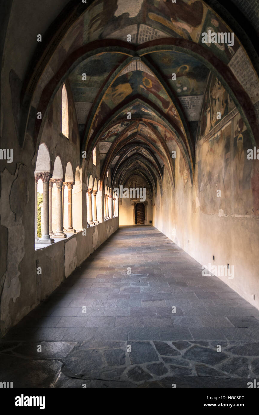 Brixen, Italy - December 26, 2016: Cathedral cloister with the frescoed wall. The ceiling cloister with depicting scenes of the Bible. Stock Photo