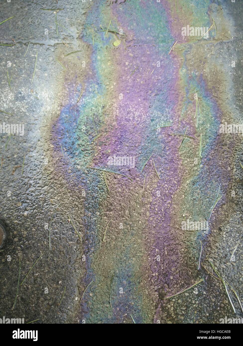 Oil Spill rainbow colors on tarmac Stock Photo