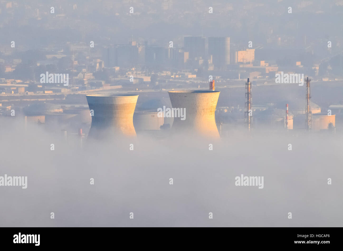 Petrochemical factory and Oil Refinery in smoke and smog. Photographed in Haifa Bay, Israel Stock Photo
