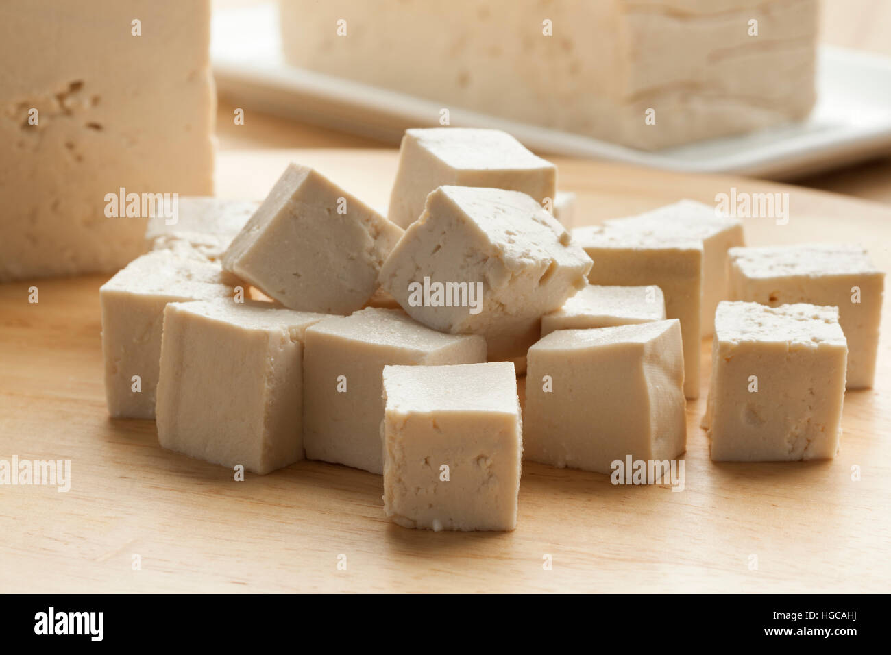 Fresh cut pieces of raw tofu Stock Photo