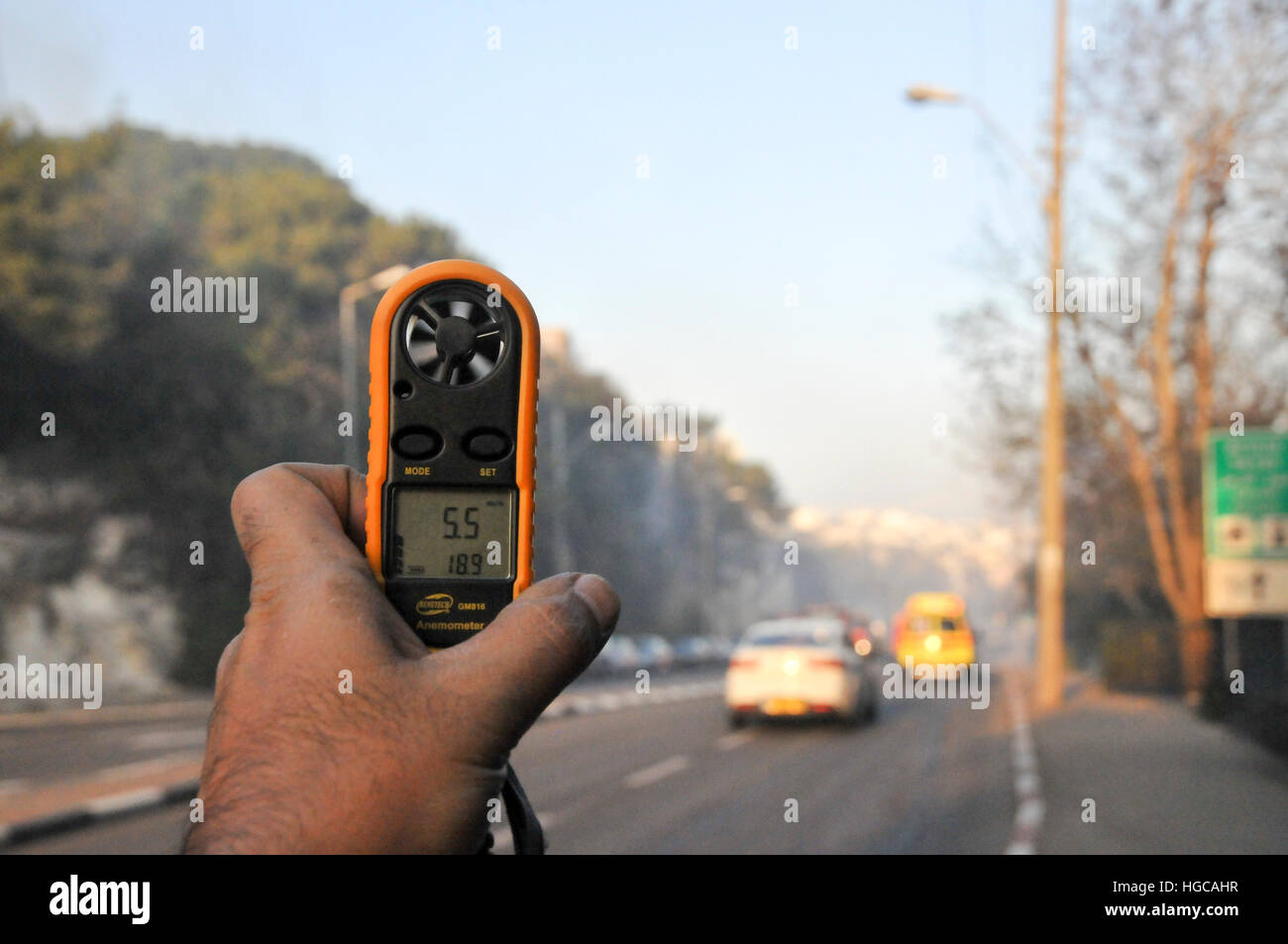 Hand held Anemometer and thermometer during the Wild fire in the city of Haifa, Israel in November 2016 Stock Photo