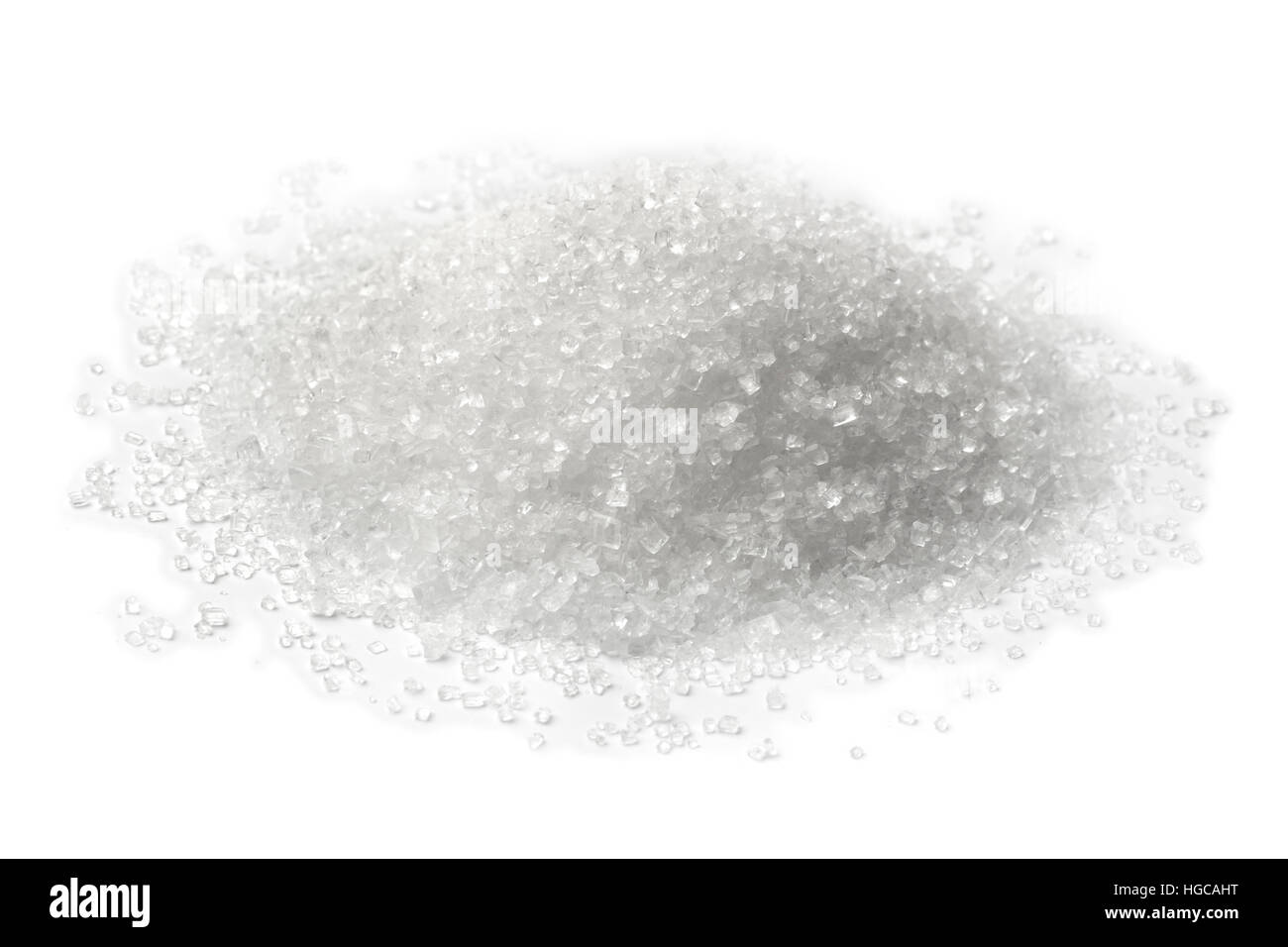 Heap of white refined sugar crystals on white background Stock Photo
