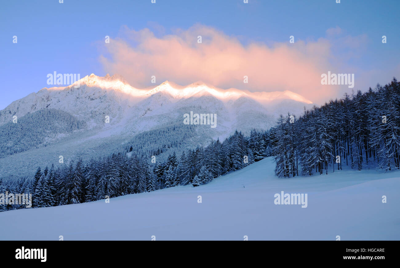 Sunrise over Snow-covered Mountains of the Marienberg-Biberview Alps (View from Obsteig in Tirol, Austria)  in Winter Stock Photo