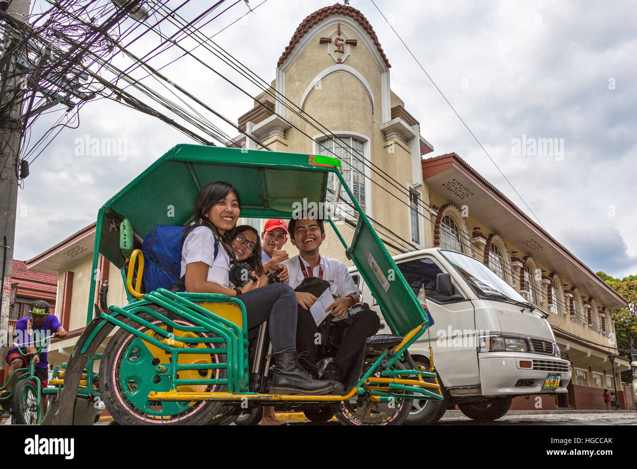Tourists in Filipino tricycle, Intramuros, Manila, Philippines Stock Photo