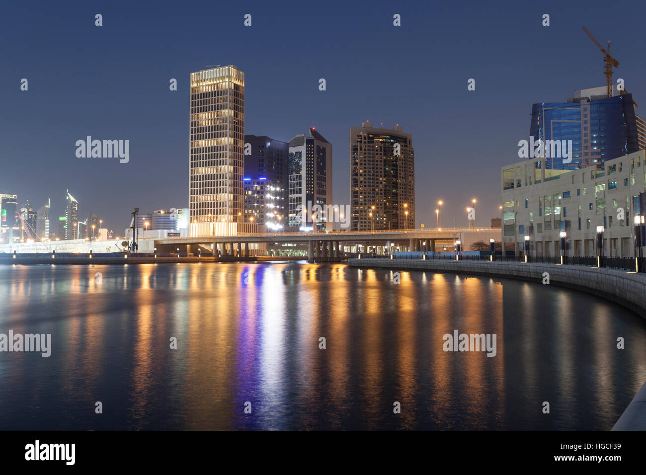 Skyline of Dubai Business Bay illuminated at night Stock Photo