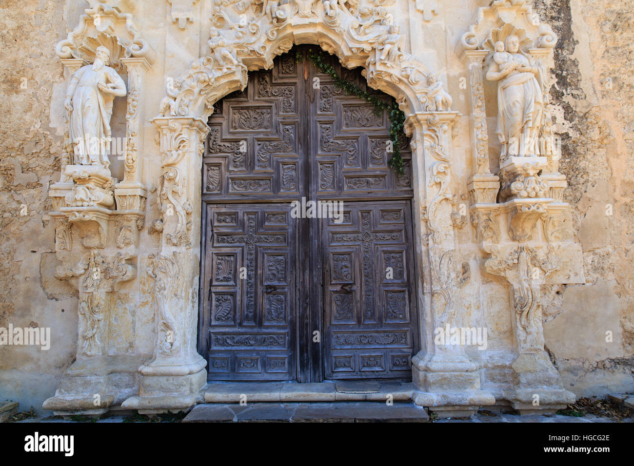 The intricately carved wooden door at Mission San Josè in San Antonio