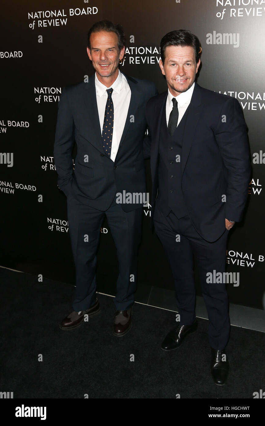 Director Peter Berg (L) and Mark Wahlberg attend the National Board of Review at Cipriani's in New York on January 4, 2017. Stock Photo