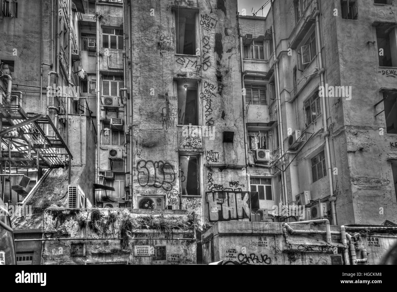 A weathered building covered in graffiti  in Tang Lung Street, Hong Kong Stock Photo