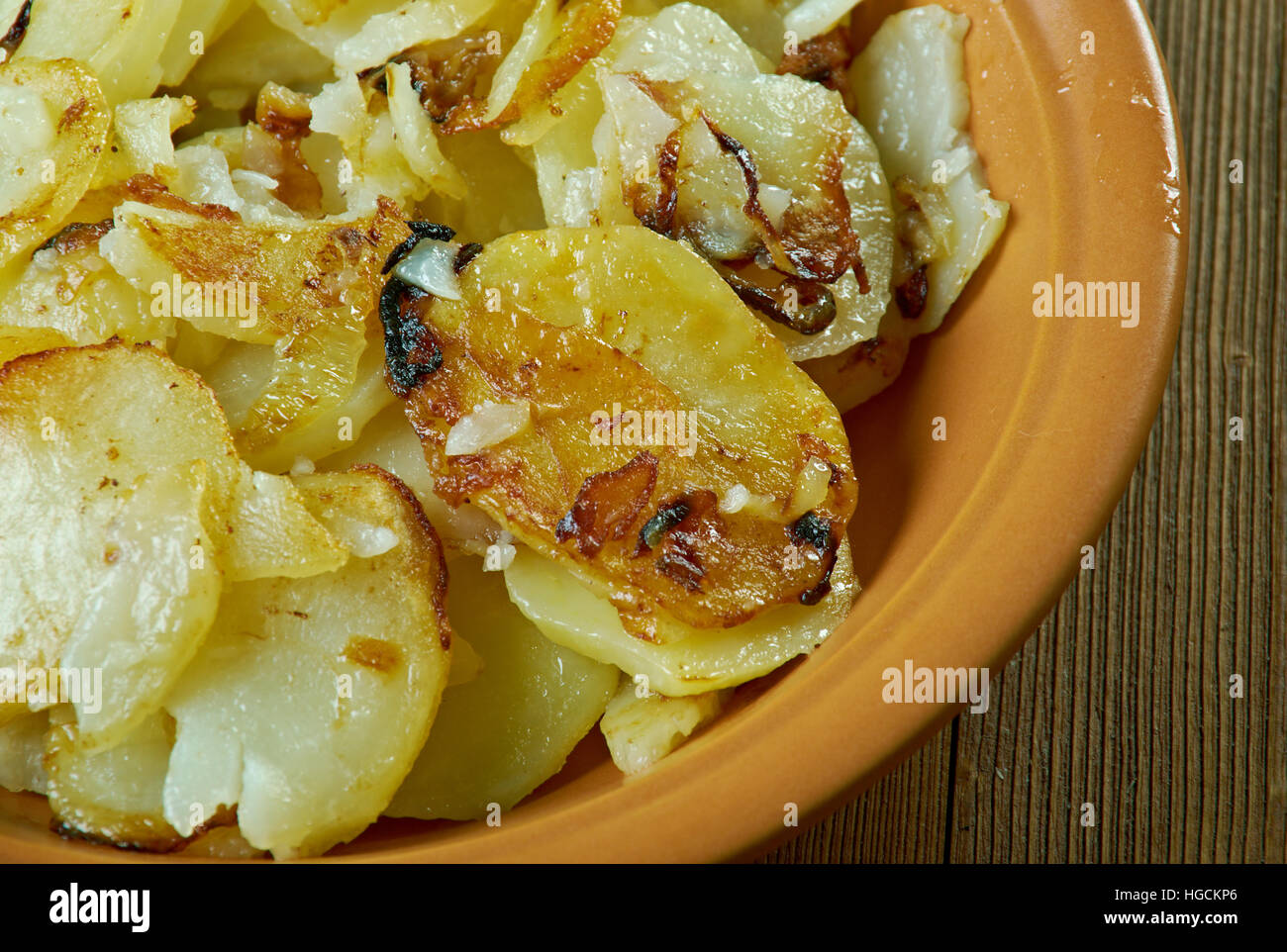 Lyonnaise potatoes French dish , fried potatoes with onion, parsley
