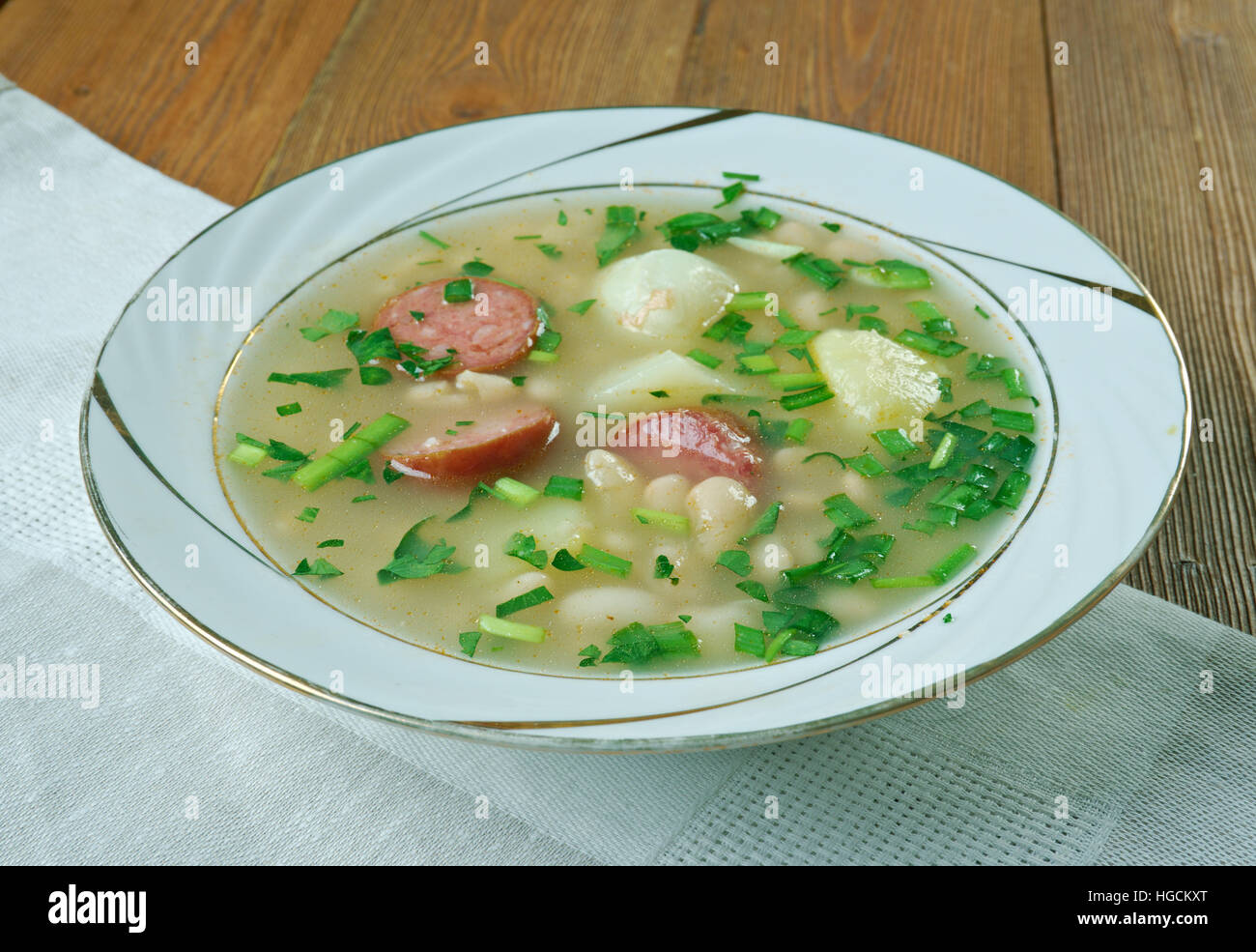 Slow Cooker Sausage, Spinach and White Bean Soup.close up Stock Photo