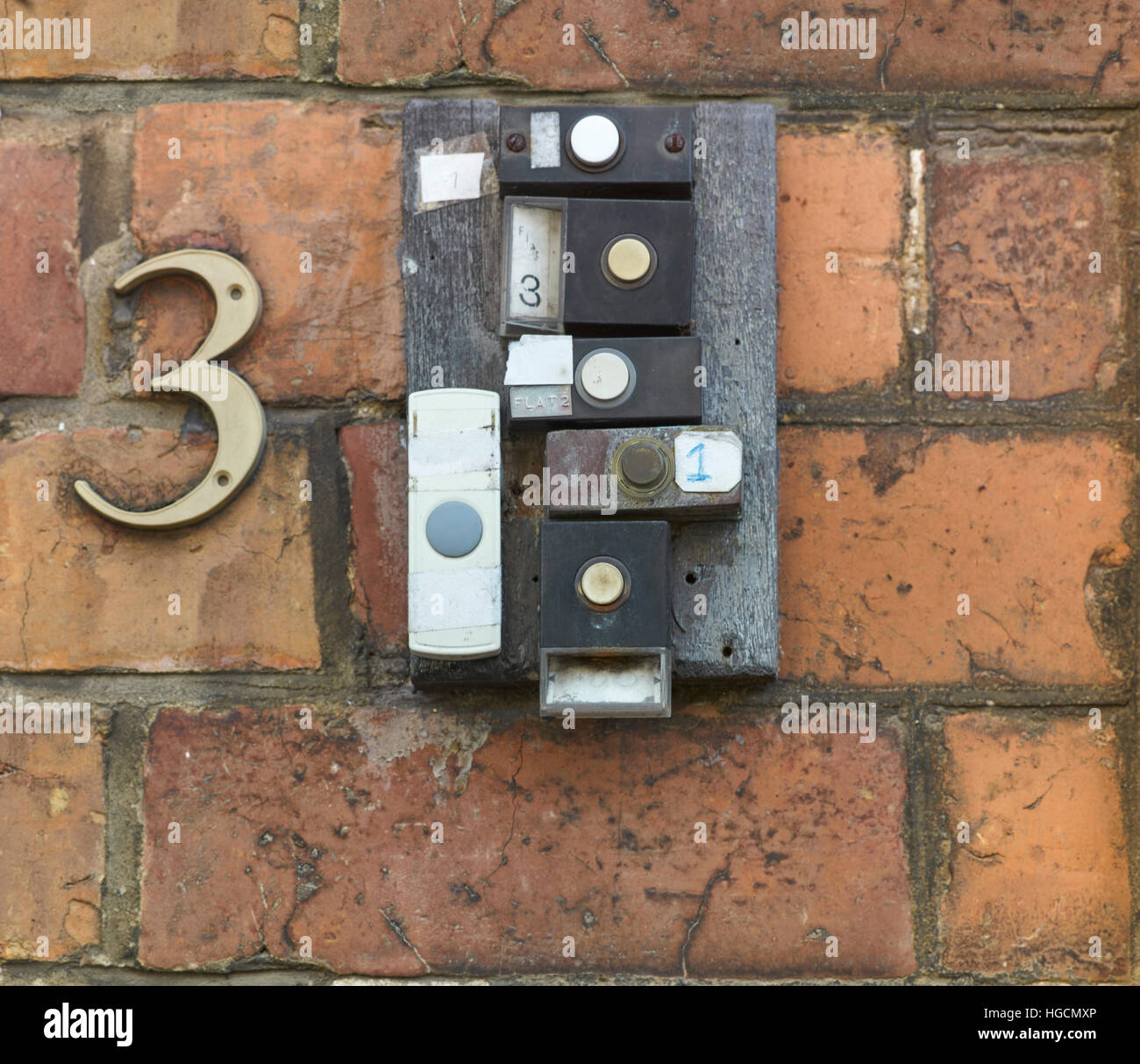 6 doorbells on a brick wall Stock Photo