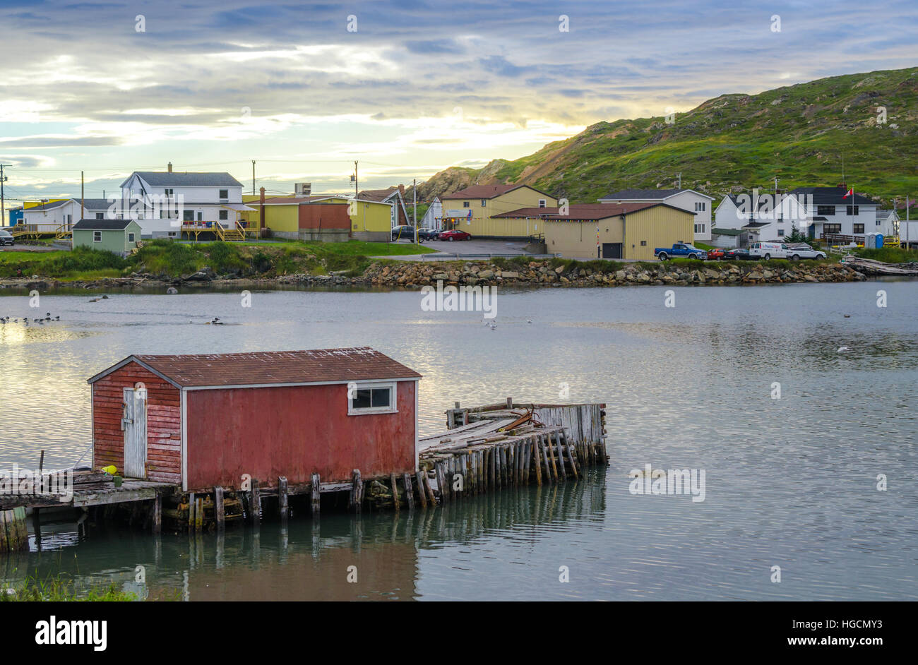 Sunset at little red dock house in village community of Twillingate, Newfoundland. Stock Photo