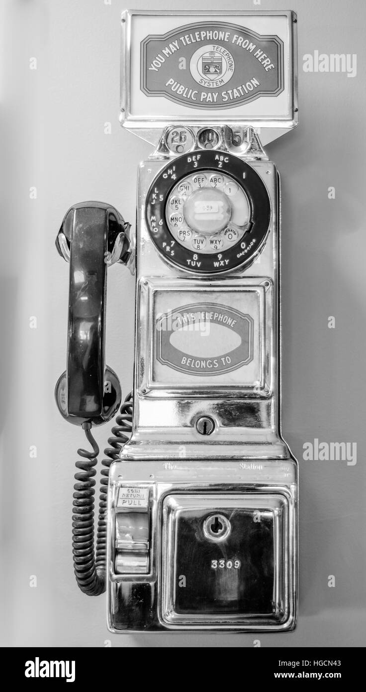 Vintage, old-style, retro, coin operated, pay telephone, call from the past. Stock Photo