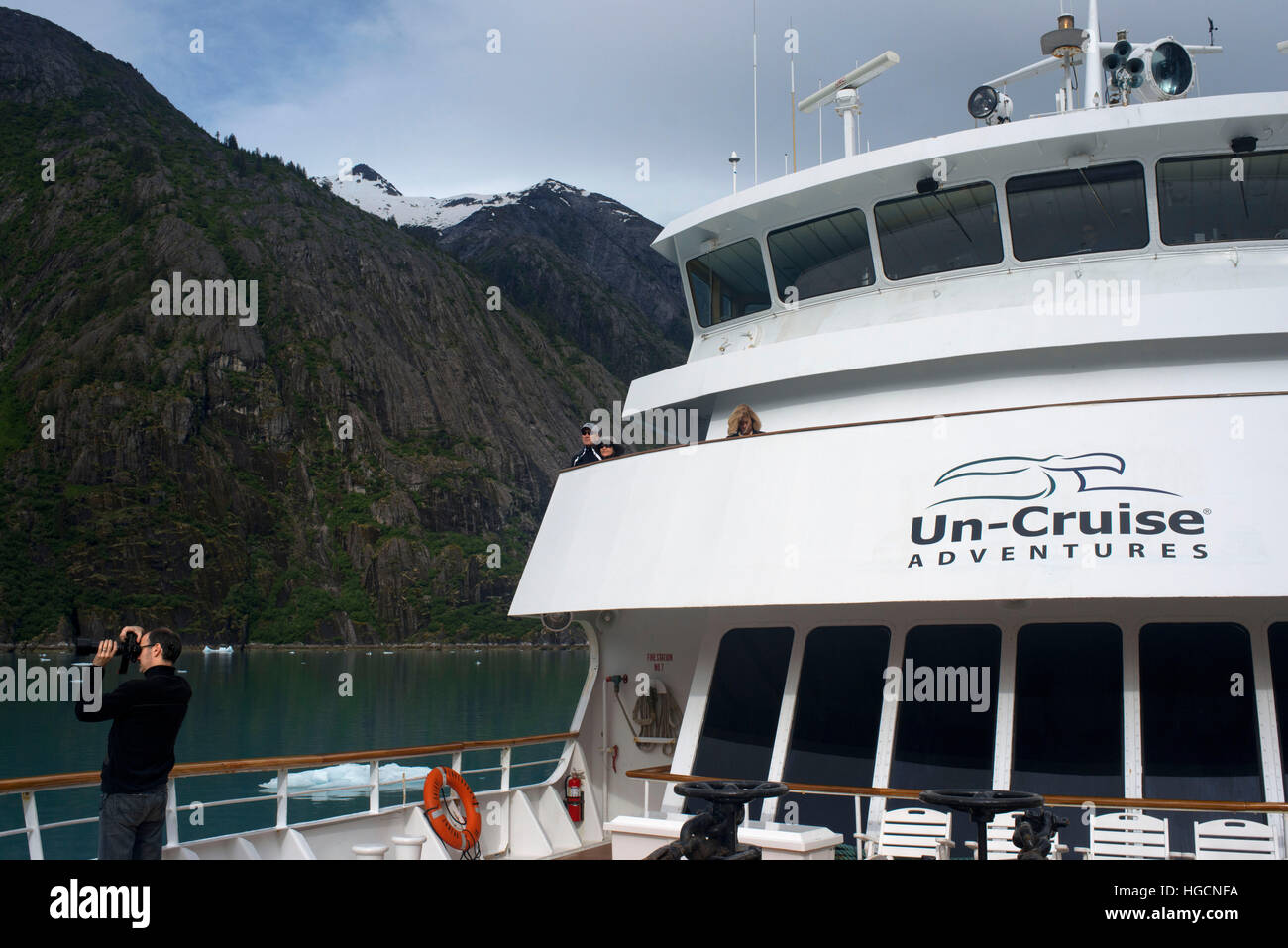 Passengers on cruise ship Safari Endeavour at anchor at Fords Terror, Endicott Arm, Tongass National Forest, Juneau, Alaska, USA. Cliff-walled fjords Stock Photo