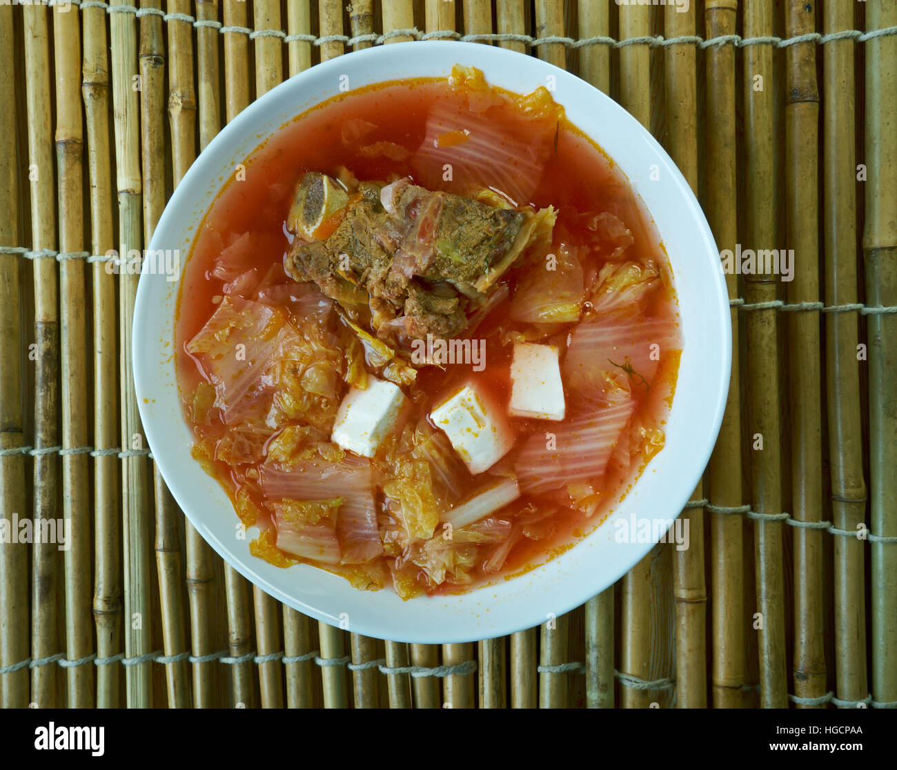 Korean signature Kimchi Stew in a hot ceramic pot served with other side  dishes Stock Photo - Alamy