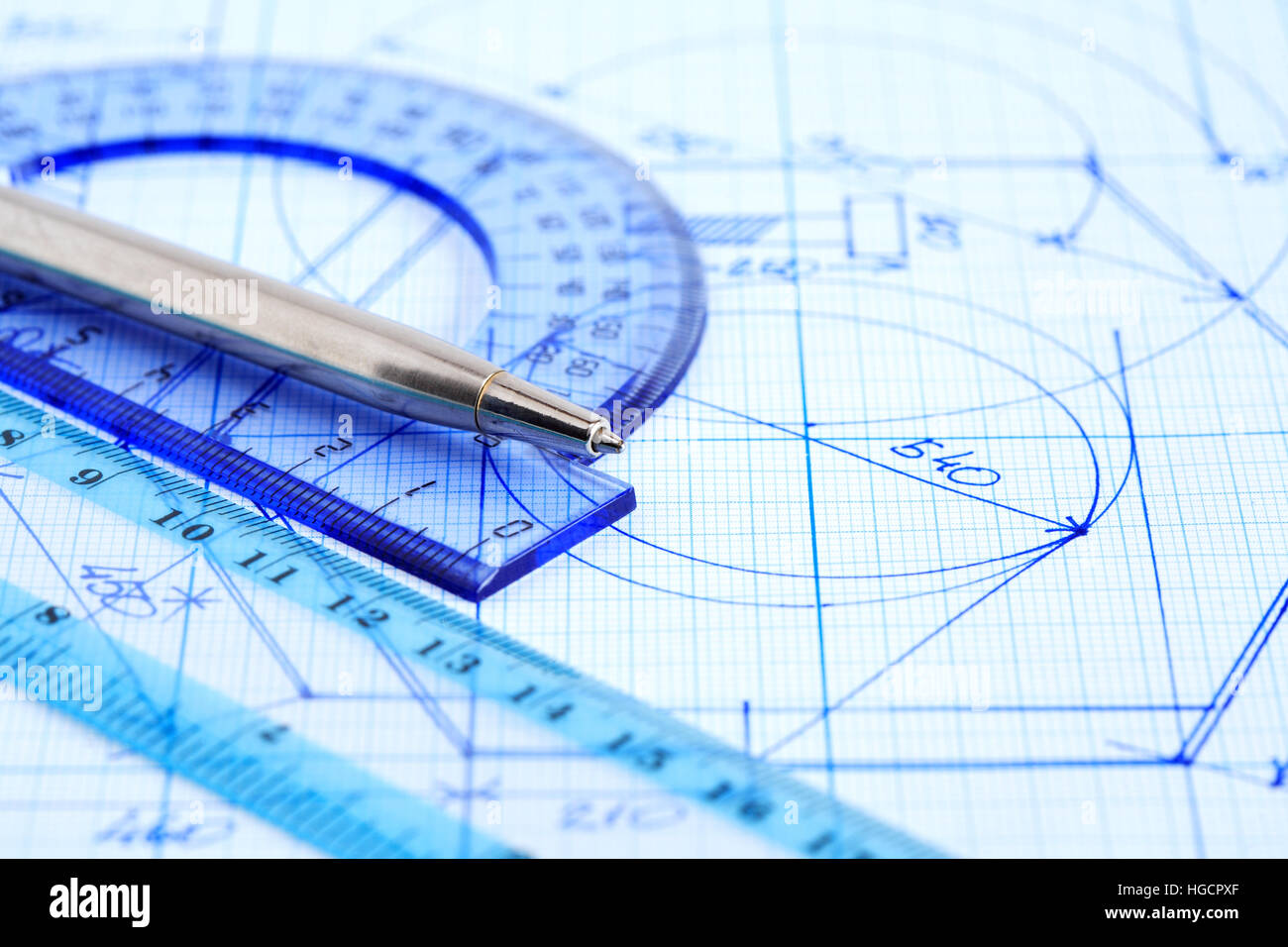 Business concept. Closeup of pen near rulers on graph paper with draft Stock Photo