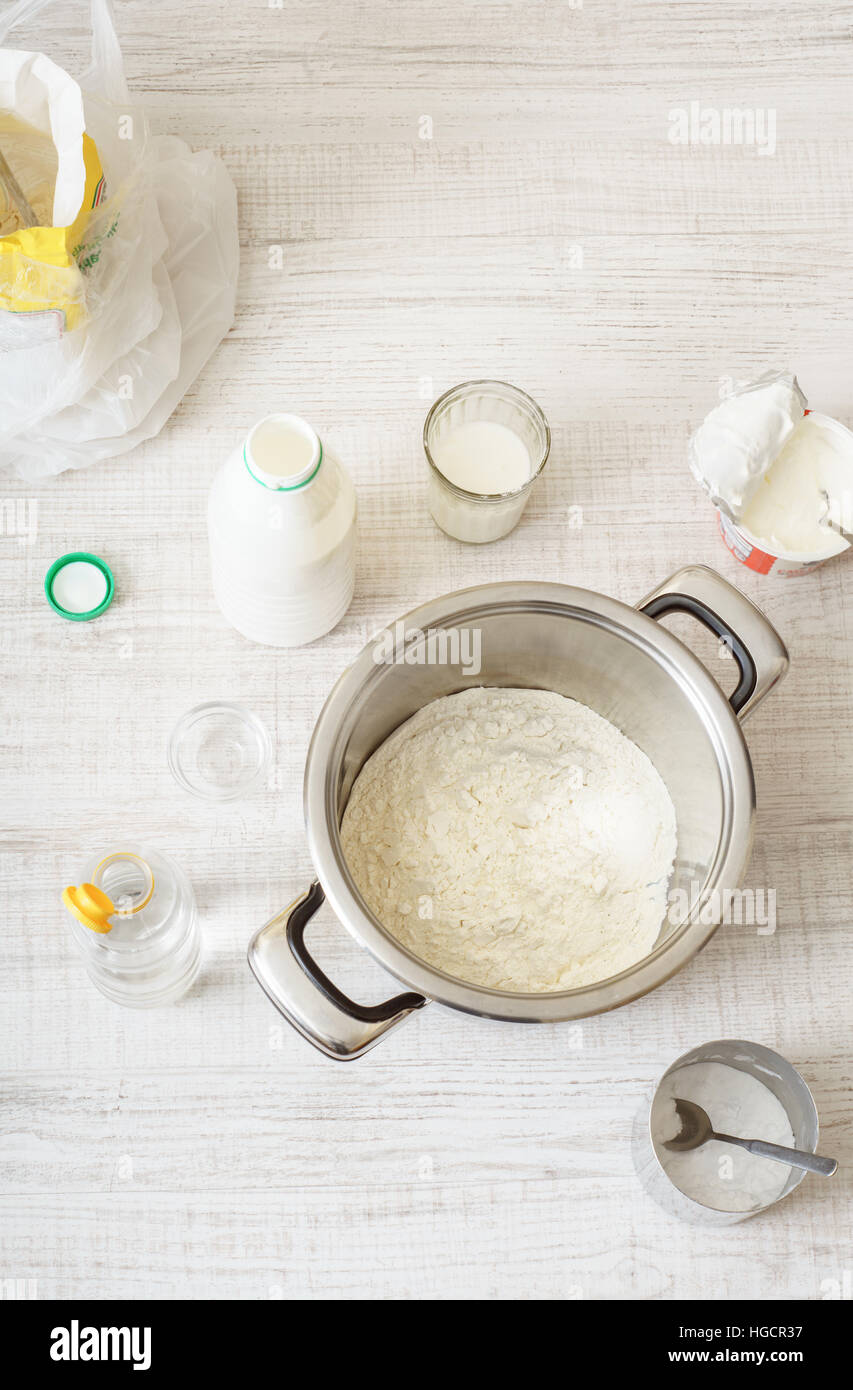 Ingredients for cooking dought pizza on the wooden table vertical Stock Photo
