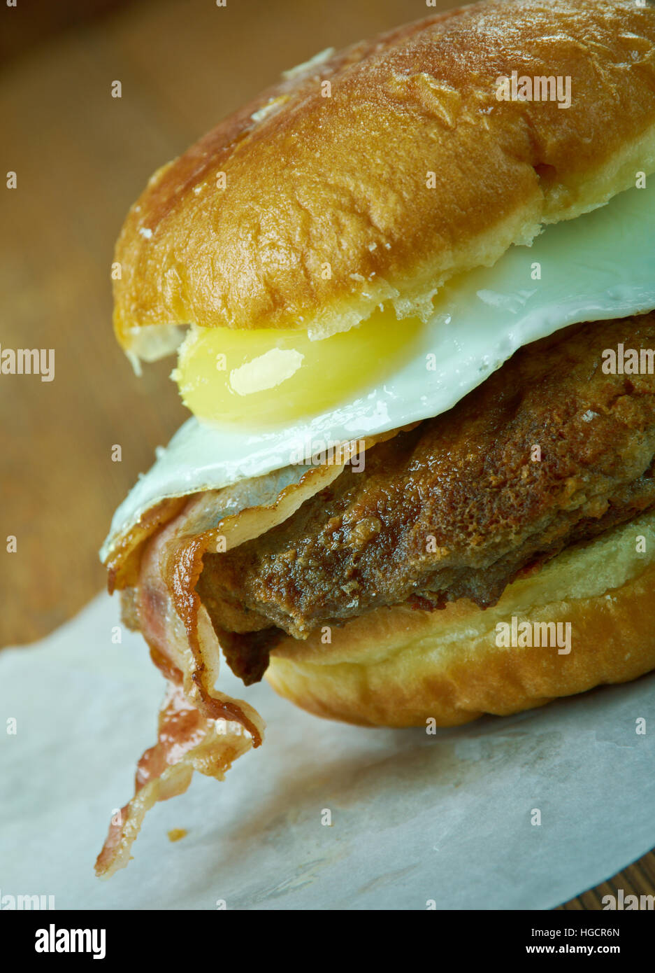 Luther Burger - hamburger or cheeseburger with one or more glazed doughnuts in place of the bun. Stock Photo