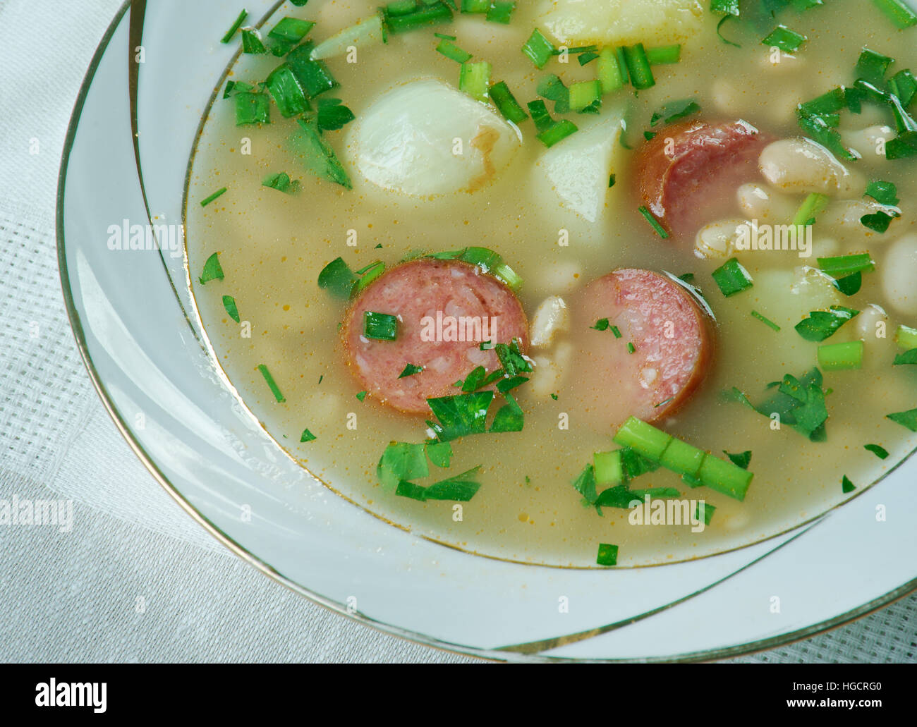 Slow Cooker Sausage, Spinach and White Bean Soup.close up Stock Photo