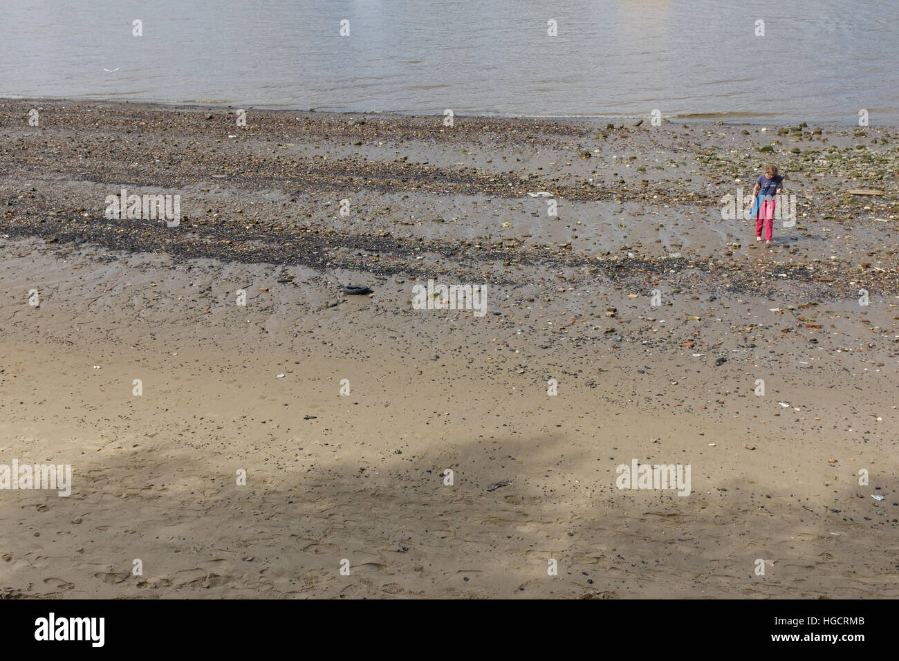 Woman alone walking beach hi-res stock photography and images - Alamy