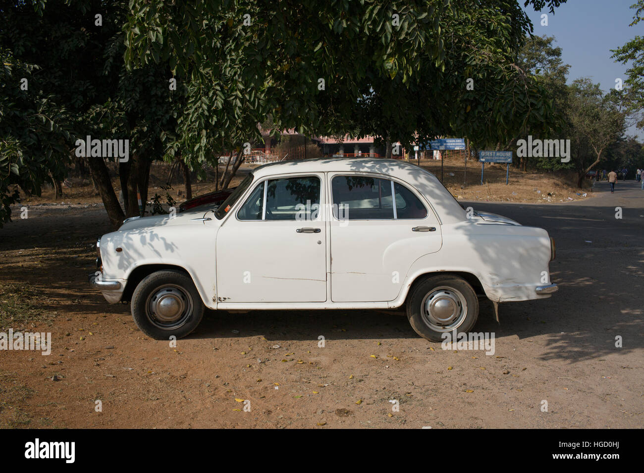 HYDERABAD, INDIA - JANUARY 07,2017 A white ambassador car parked under a tree in Hyderabad,India Stock Photo