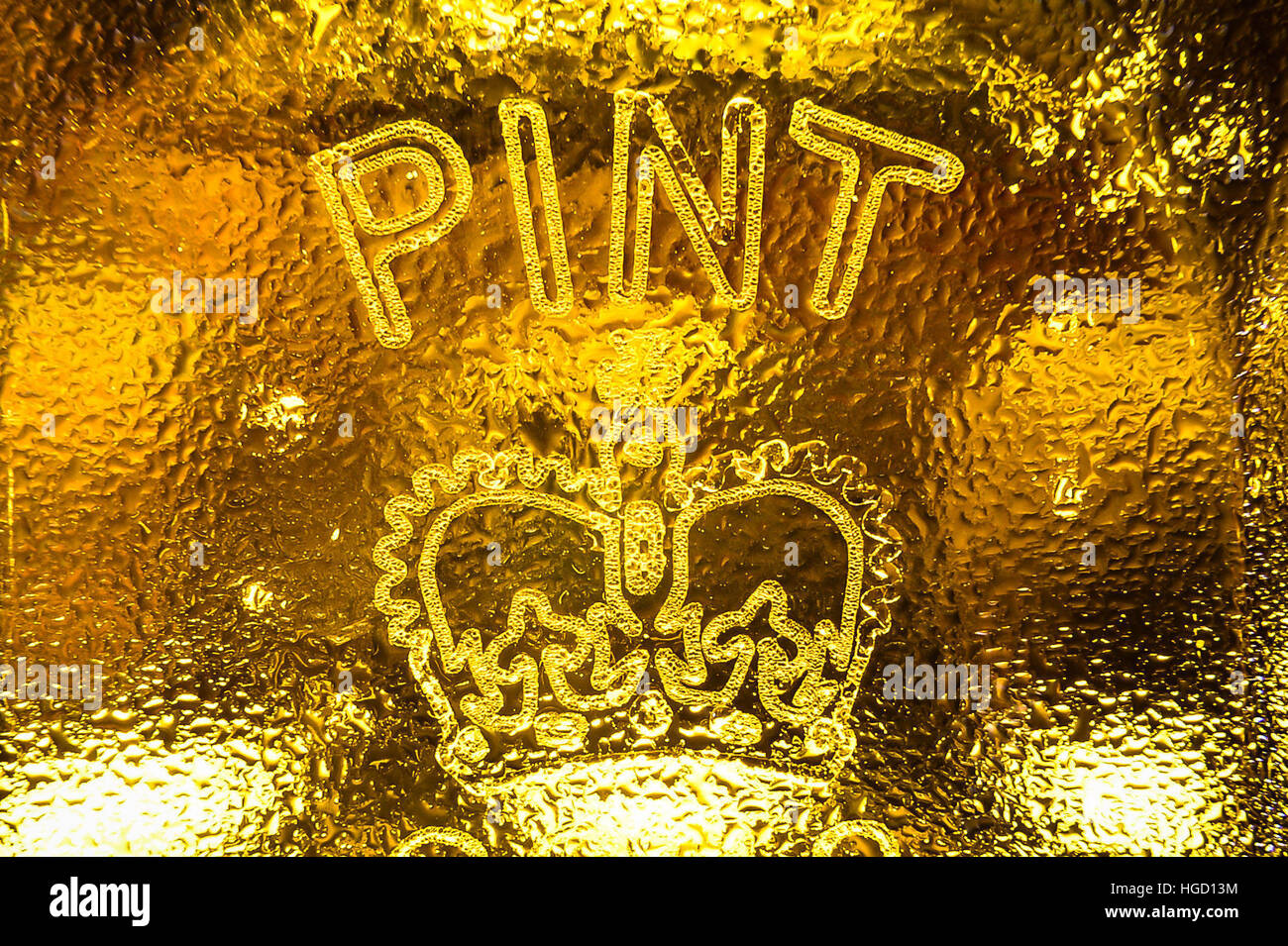 A dimpled pint glass etched with the Crown stamp rather than the European CE marking, as Ukip MEP Bill Etheridge has backed calls for the return of traditional Crown stamps on Britains pint glasses - a decade after they began to disappear in favour of an EU-wide &Ograve;European Conformity&Oacute; mark. Stock Photo