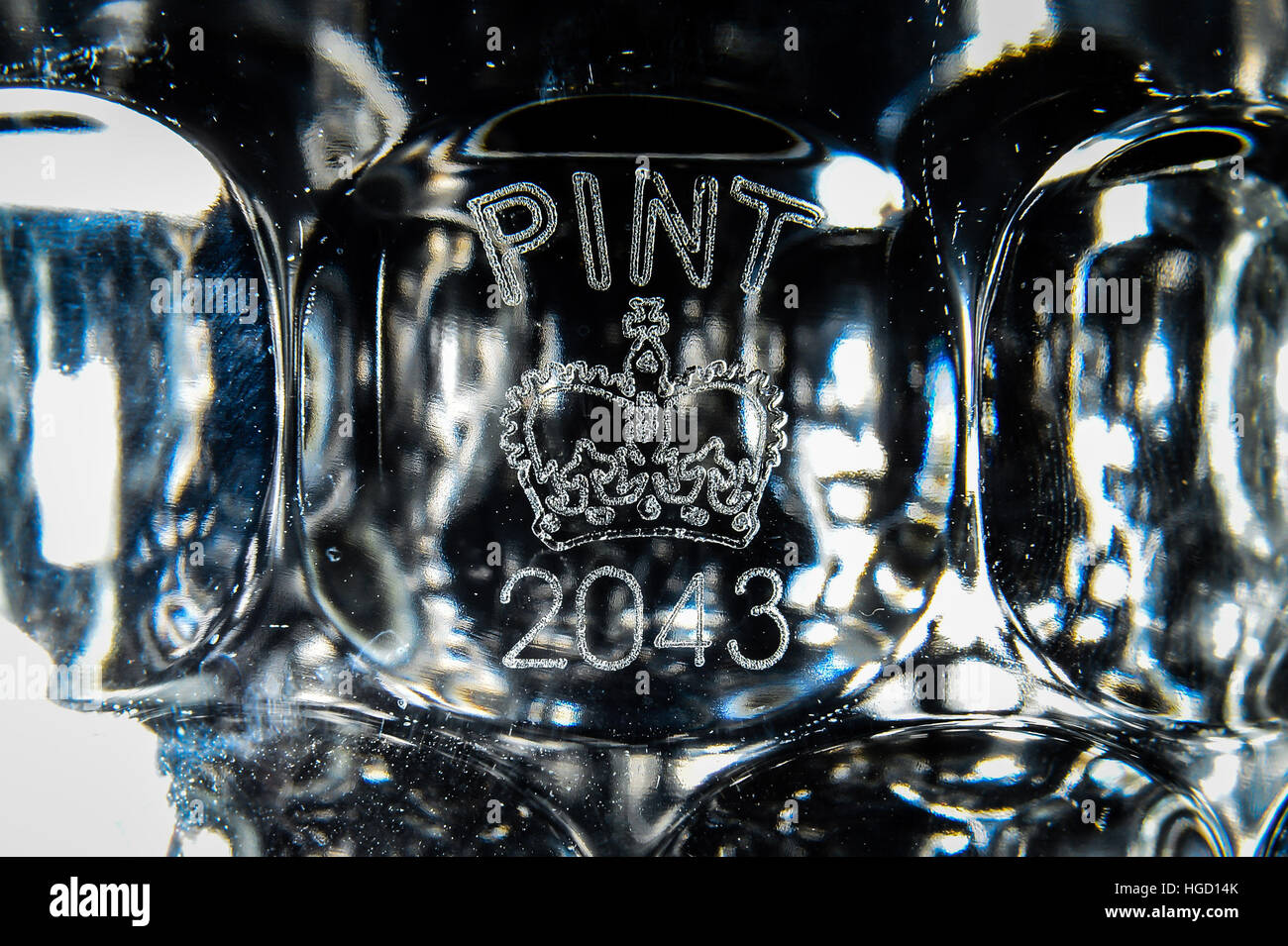 A dimpled pint glass etched with the Crown stamp rather than the European CE marking, as Ukip MEP Bill Etheridge has backed calls for the return of traditional Crown stamps on Britain&Otilde;s pint glasses - a decade after they began to disappear in favour of an EU-wide &Ograve;European Conformity&Oacute; mark. Stock Photo