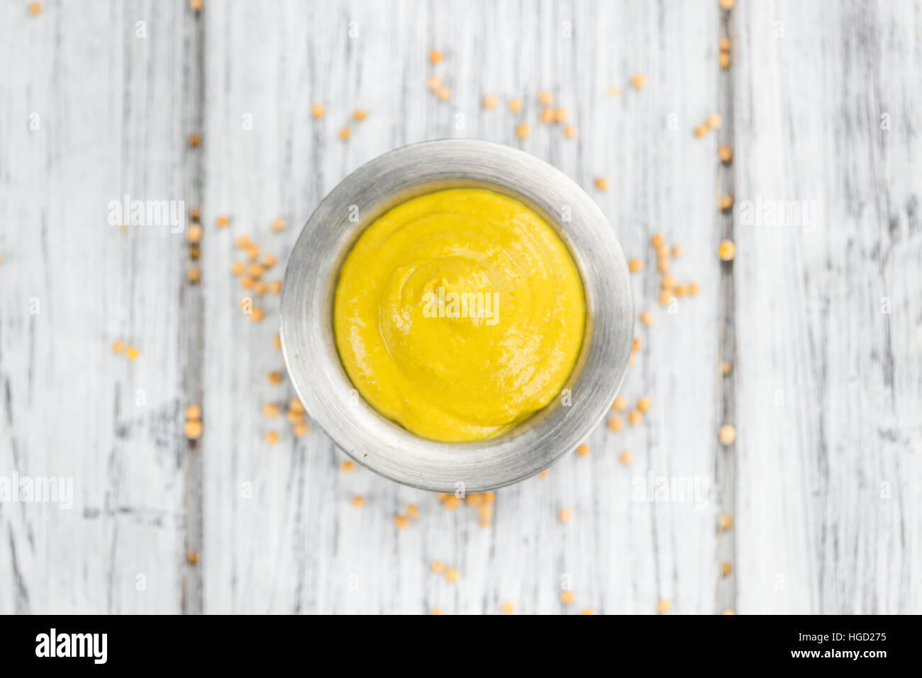 Portion of homemade Mustard on wooden background (selective focus; close-up shot) Stock Photo