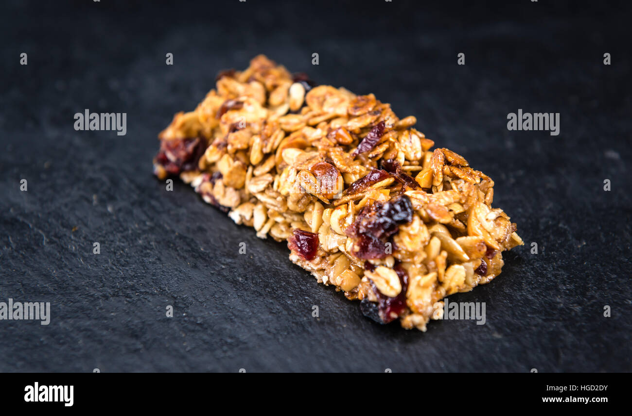 Homemade Granola Bars with Peanuts and Cranberries (selective focus) as