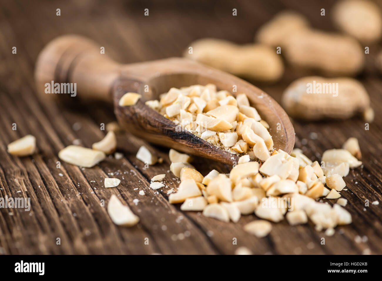 Heap of chopped Peanuts (selective focus) on vintage wooden background Stock Photo