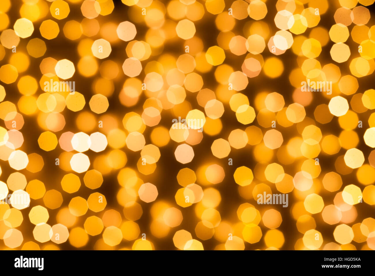 Blurred shining christmas lights decoration with warm white color to use as a background Stock Photo