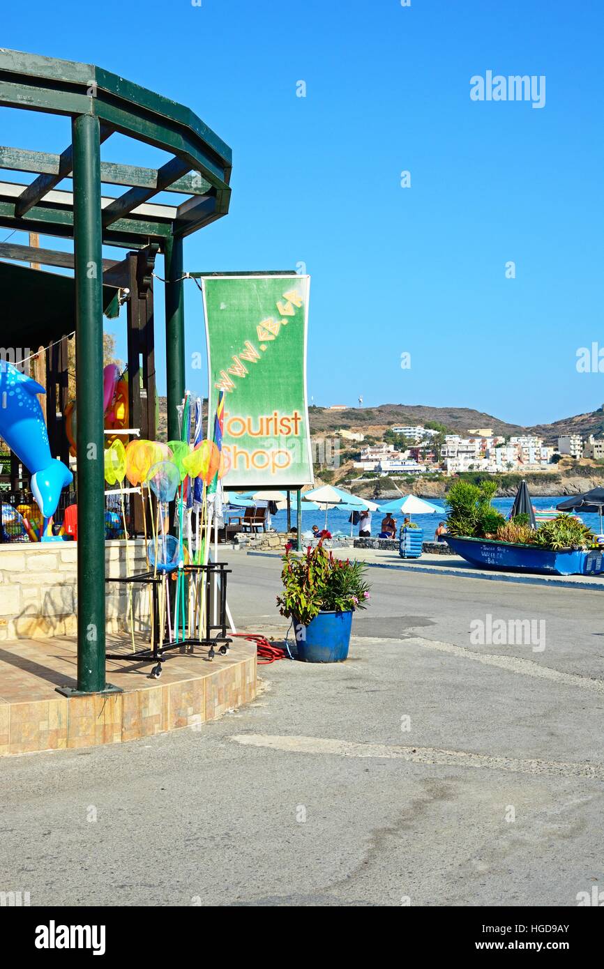 Tourist shop on the promenade with views towards Livadi Beach, Bali, Crete, Greece, Europe. Stock Photo