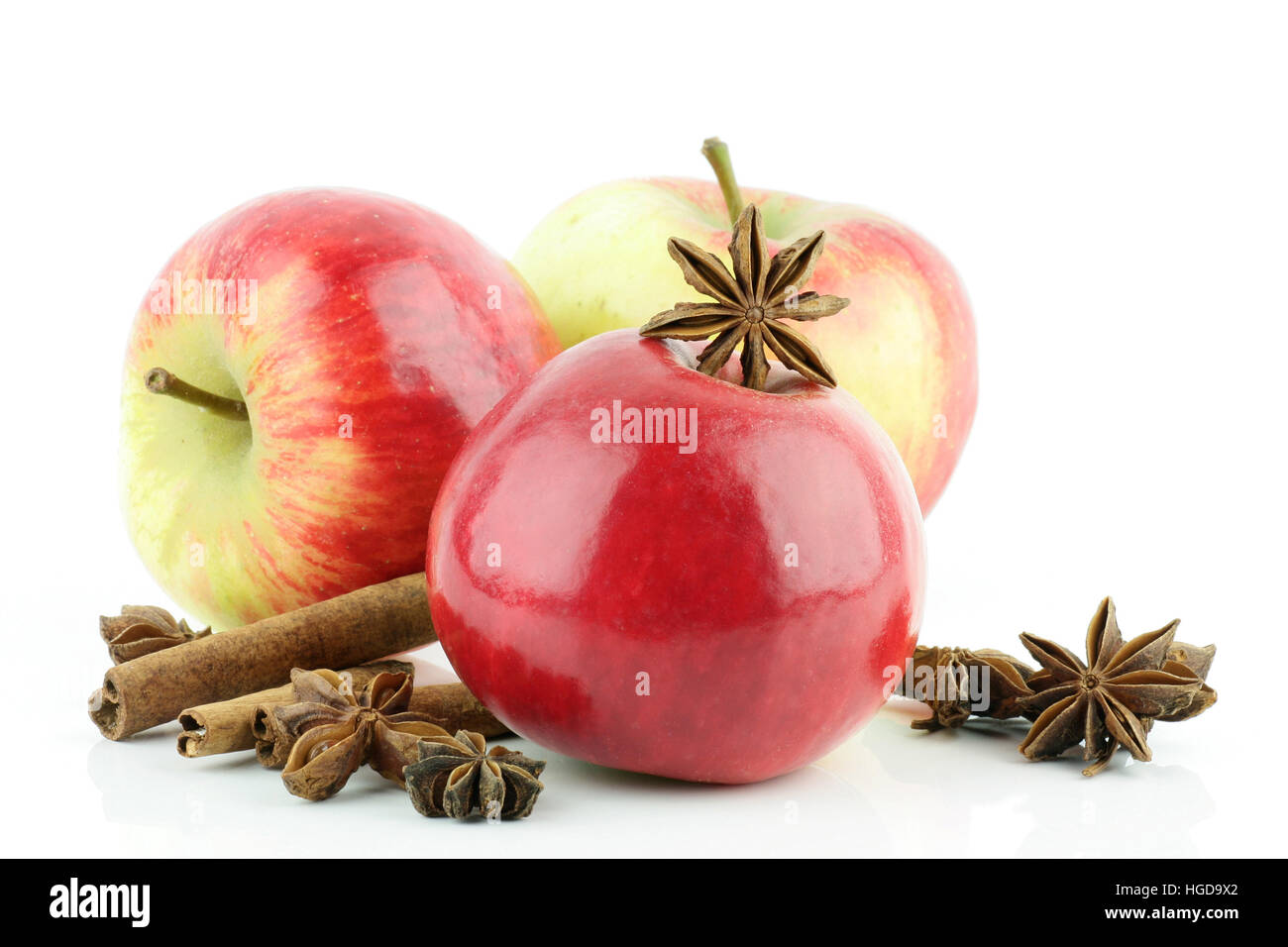 Three red Elstar apples (Malus domestica) with cinnamon and star anise, on a white background Stock Photo - Alamy