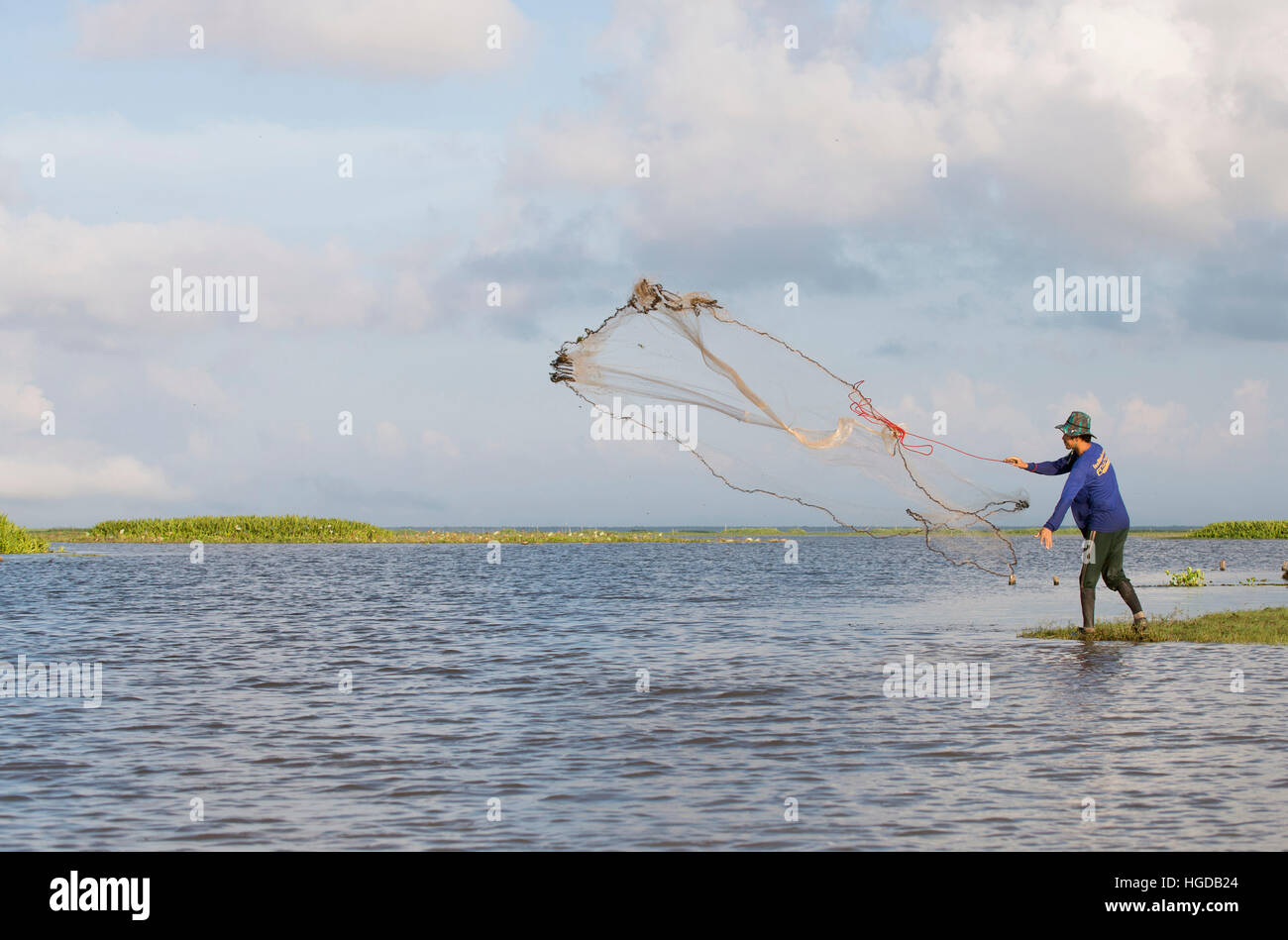 Thailand, Patthalung, Tale Noi, Fisherman, with cast net Stock Photo