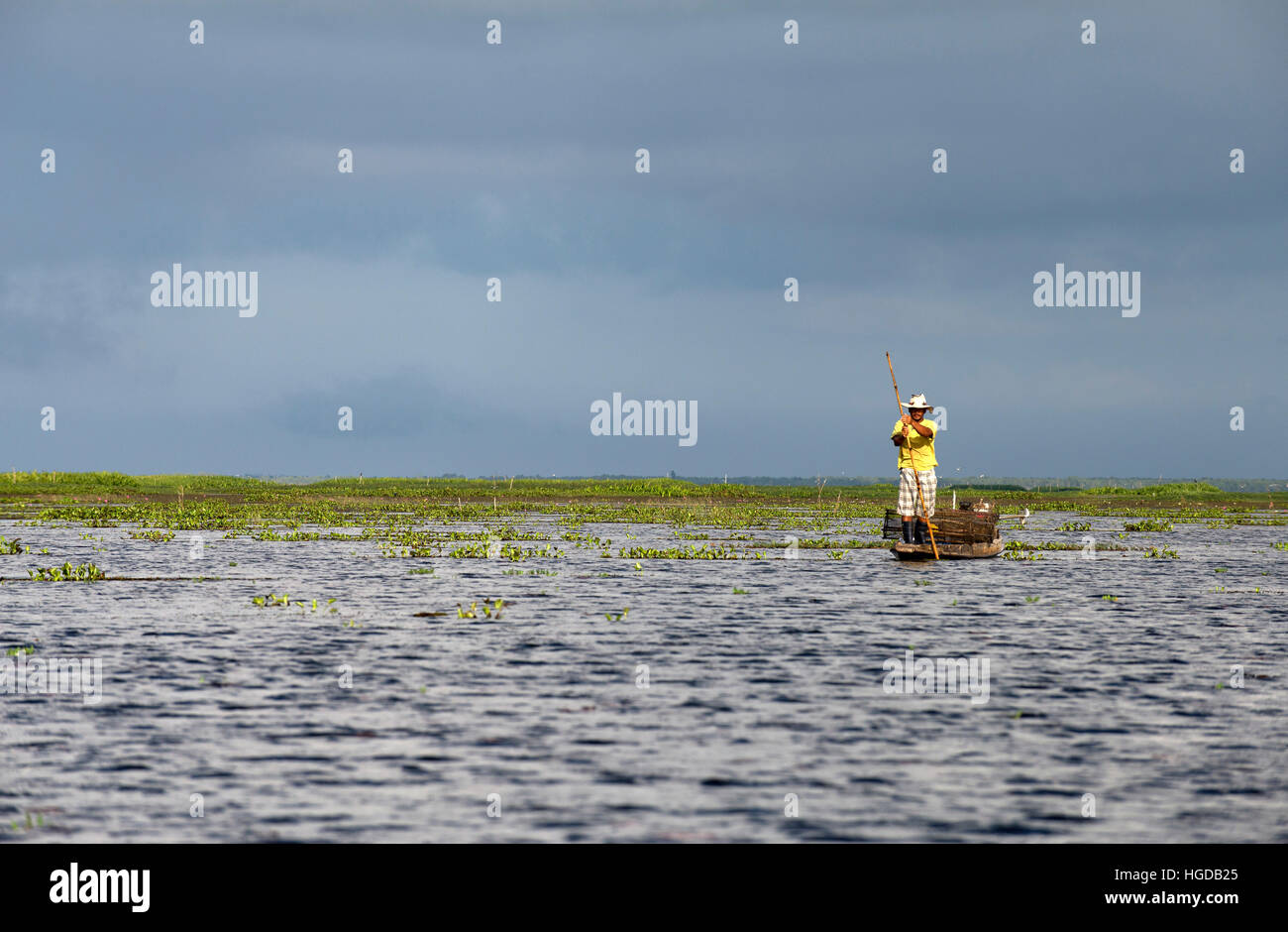 Thailand, Patthalung, Tale Noi, Fisherman, on boat with fish traps Stock Photo