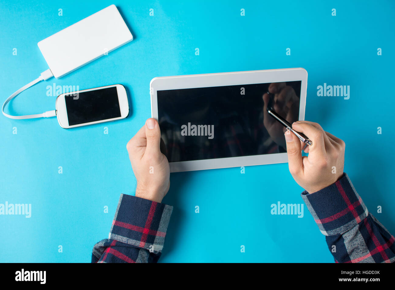 Man using a white tablet device at the office Stock Photo