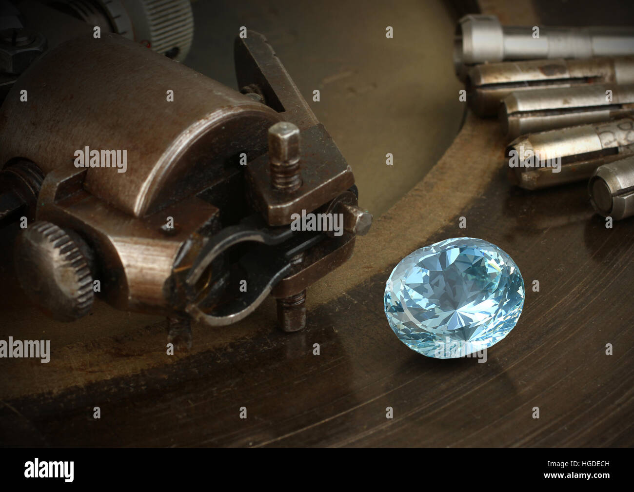Faceting gemston, big diamond with jewelery equipment. Jewellery manufacture. Stock Photo