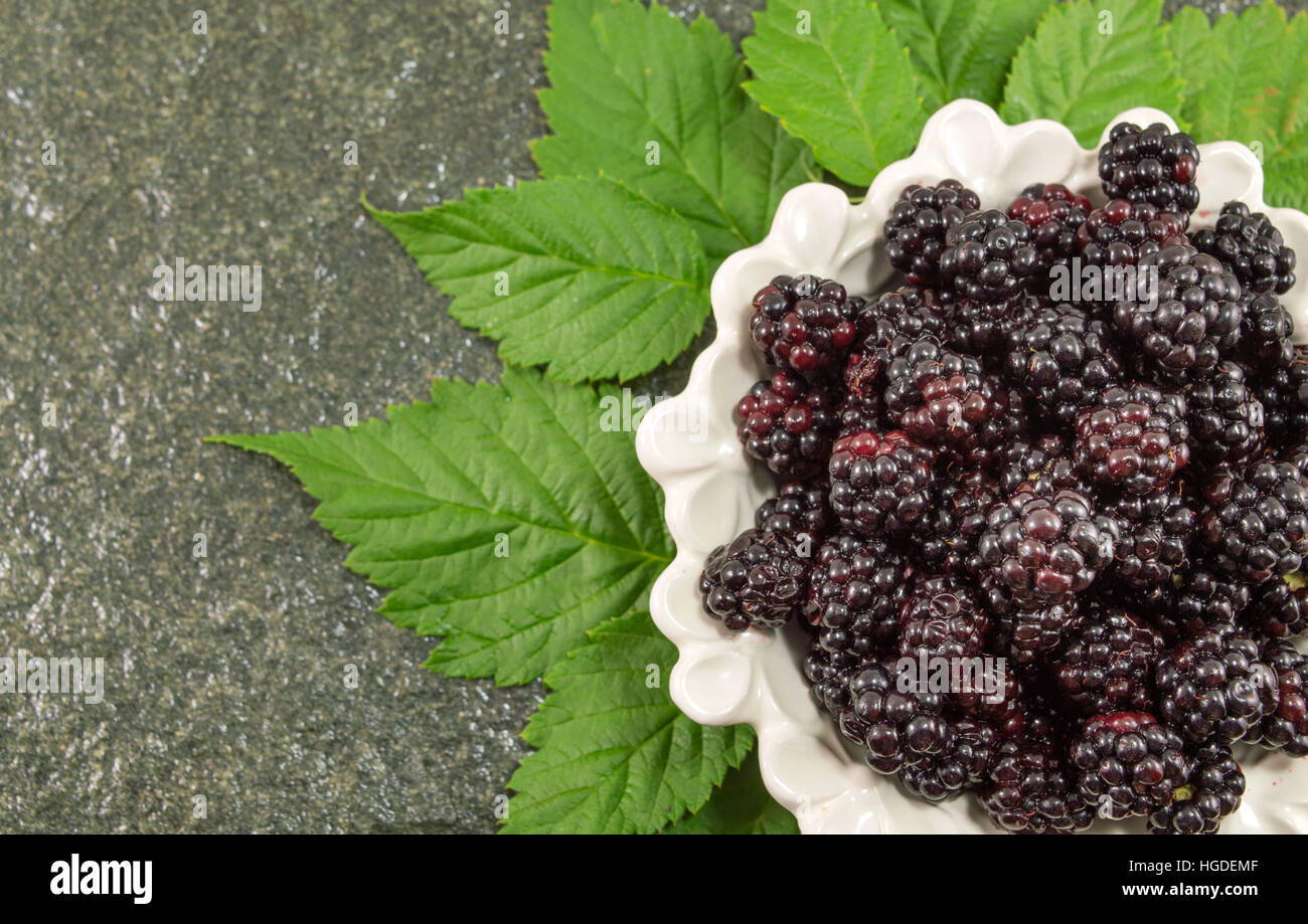 bunch of fresh juicy blackberries on a plate Stock Photo