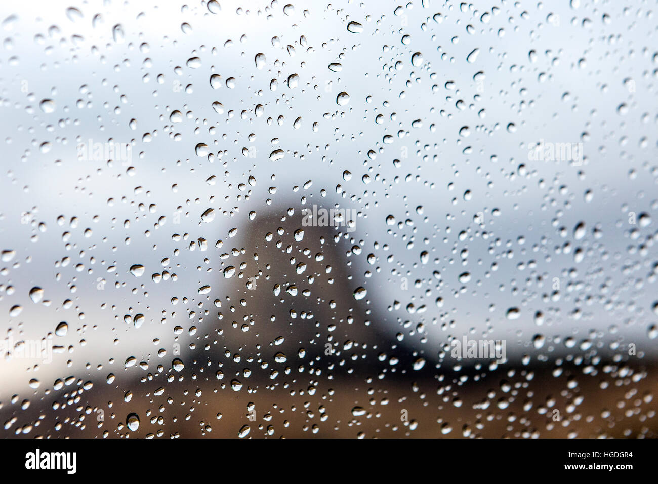 WY02245-00...WYOMING - Rain Drops on car window with Devils Tower in the distance, Devils Tower National Monument. Stock Photo