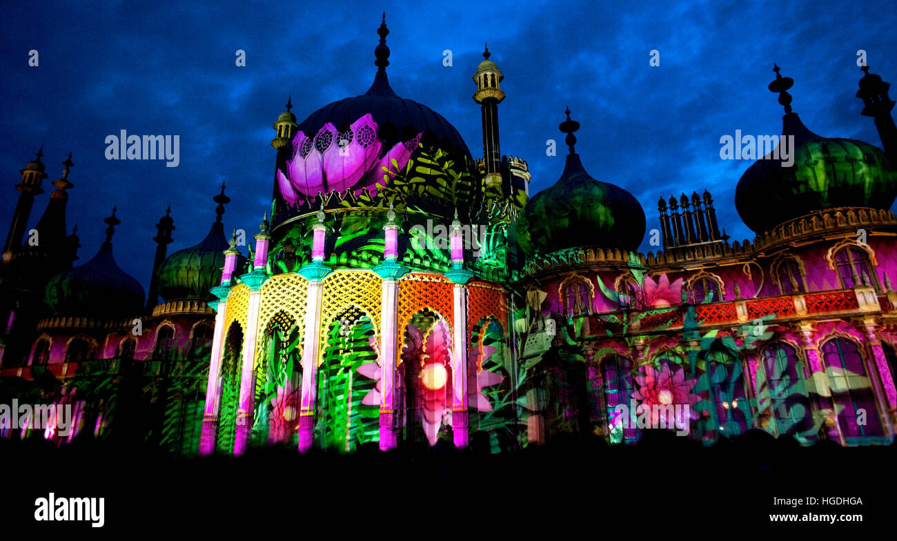 The famous Royal Pavilion is lit up with amazing illuminations and lotuses during the 2016 Brighton festival's Dr. Blighty show. Stock Photo