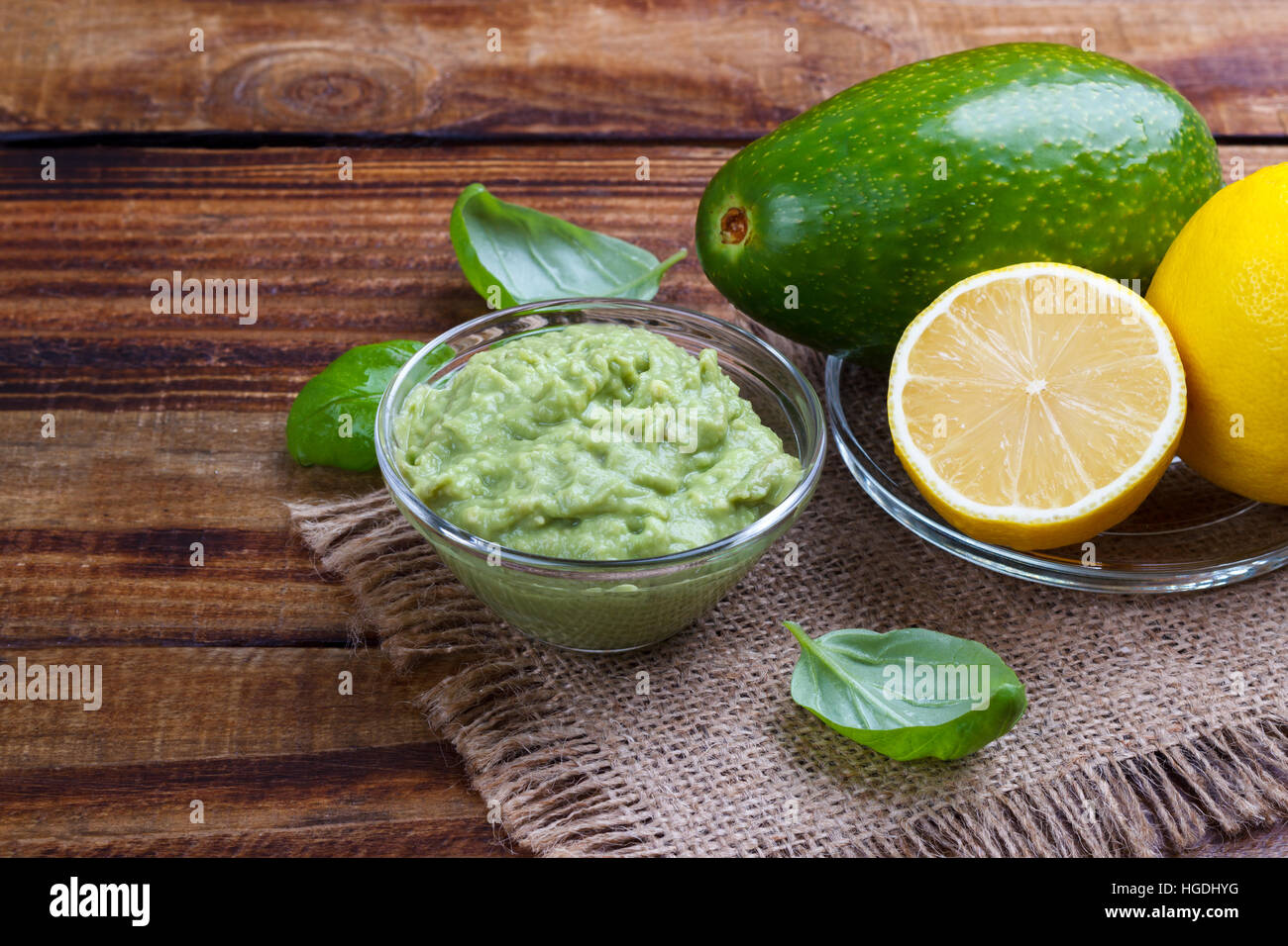 avocado guacamole sauce with ingredients, traditional Mexican dip and