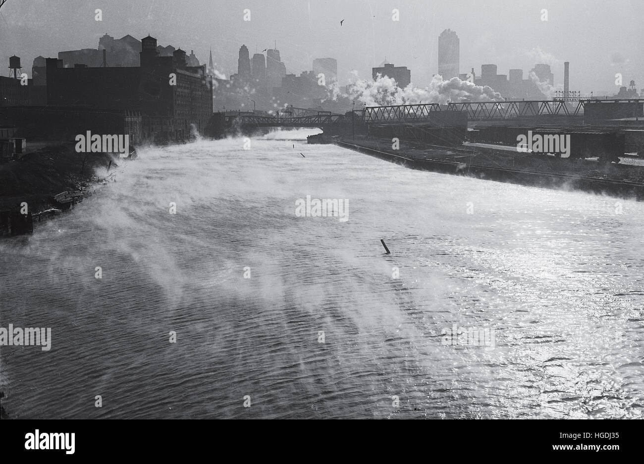 Steam rises off of the Chicago River on the industrial south side in December of 1947. Stock Photo