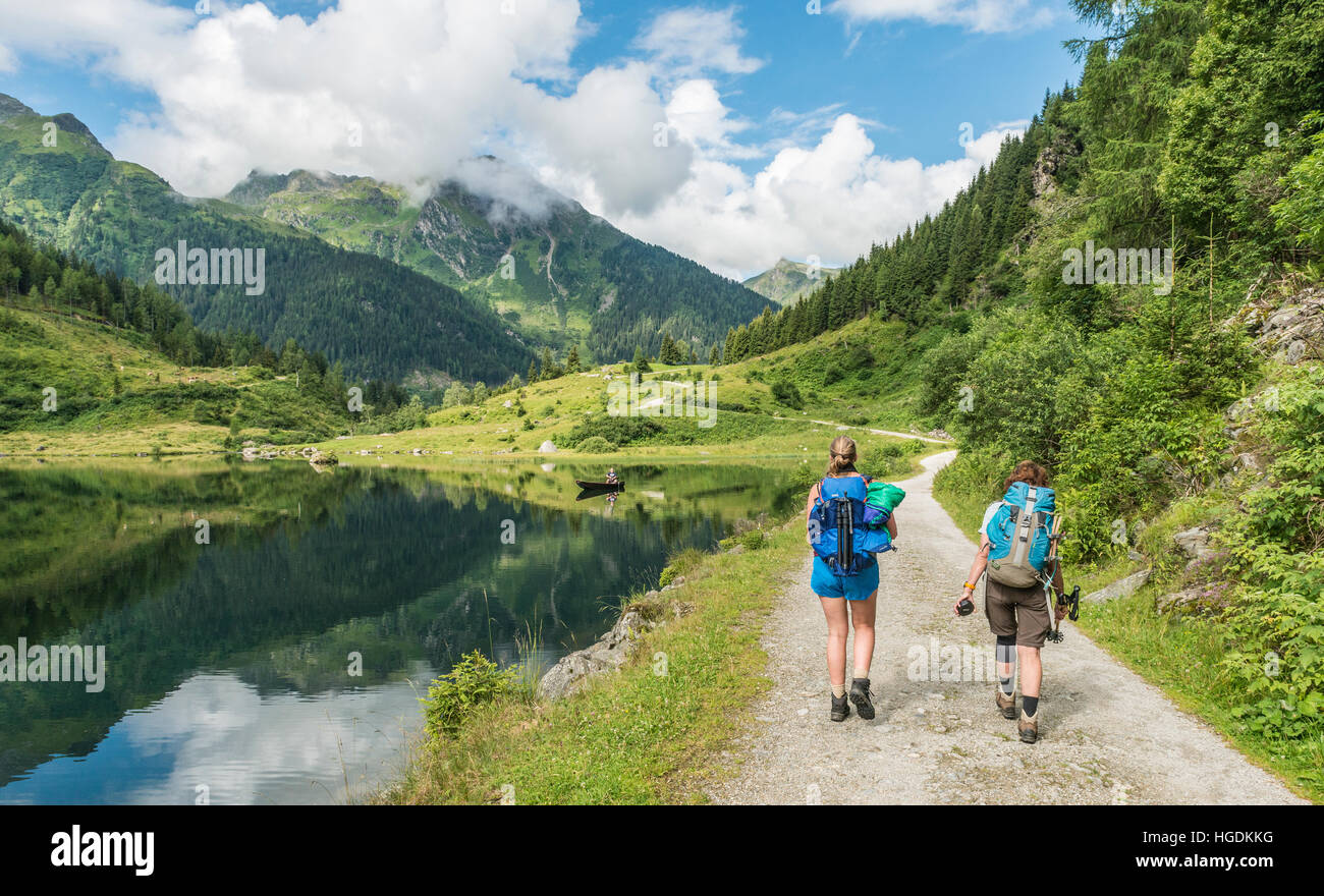 Two hikers, Riesach Lake, Rohrmoos-Untertal, Schladming Tauern, Styria, Austria Stock Photo