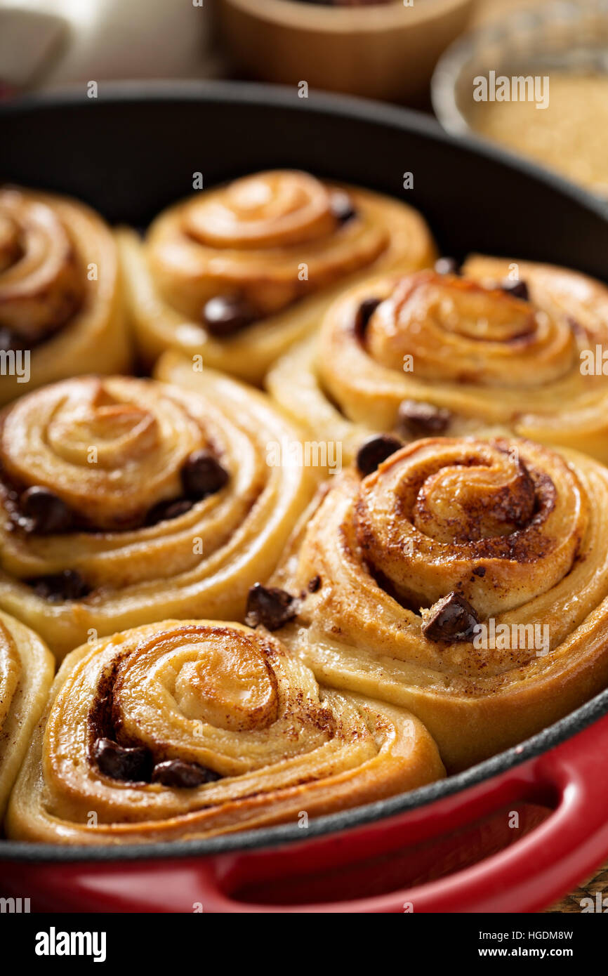 Cinnamon buns with chocolate chips baked in a cast iron pan Stock Photo
