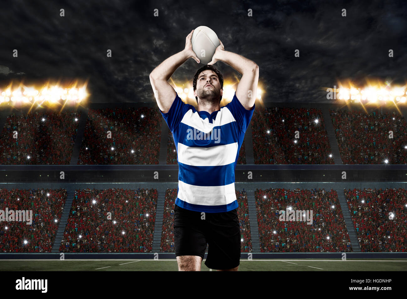 Rugby player in a blue uniform on a stadium Stock Photo - Alamy