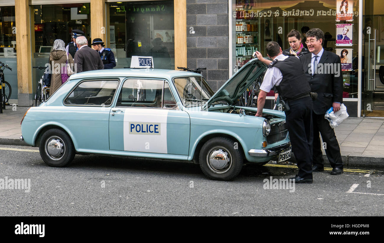 Police promotion with historic Austin 1100 patrol car London England Stock Photo
