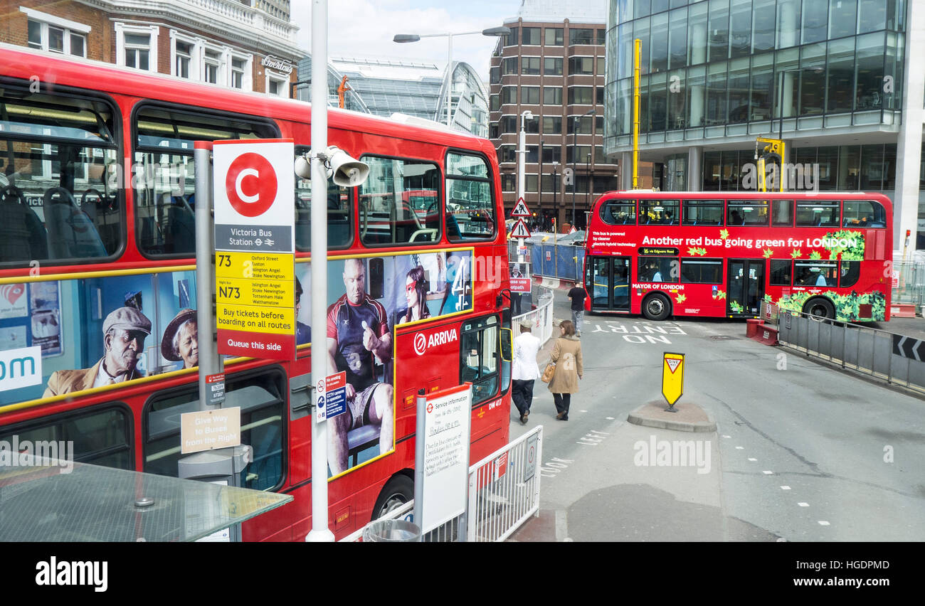 Red double decker buses Victoria Bus Station London England Stock Photo