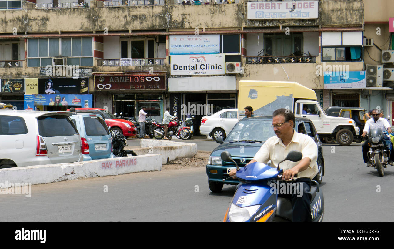 Dentist pharmacies and an optician near Market Road central Mapusa Goa India Stock Photo